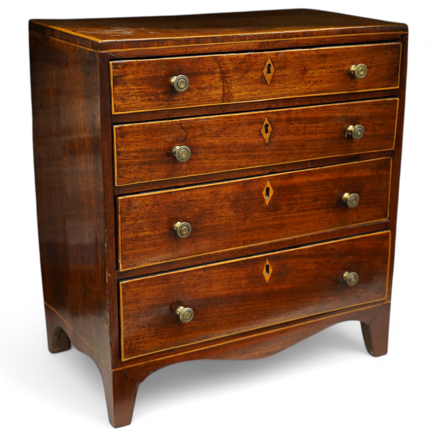 A George III mahogany miniature four drawer chest and key, 40cm high, 35.5cm wide. Condition - good